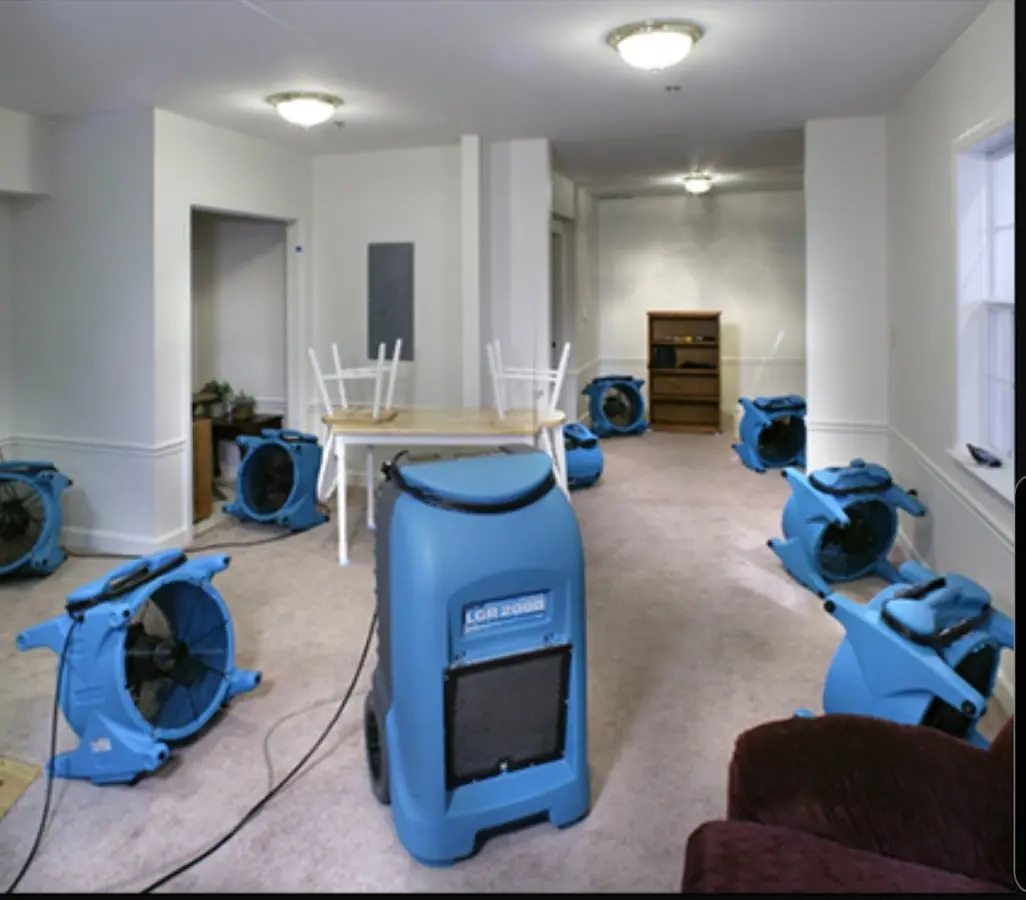 Air movers and dehumidifier setup for Water Damage Restoration in Highlands